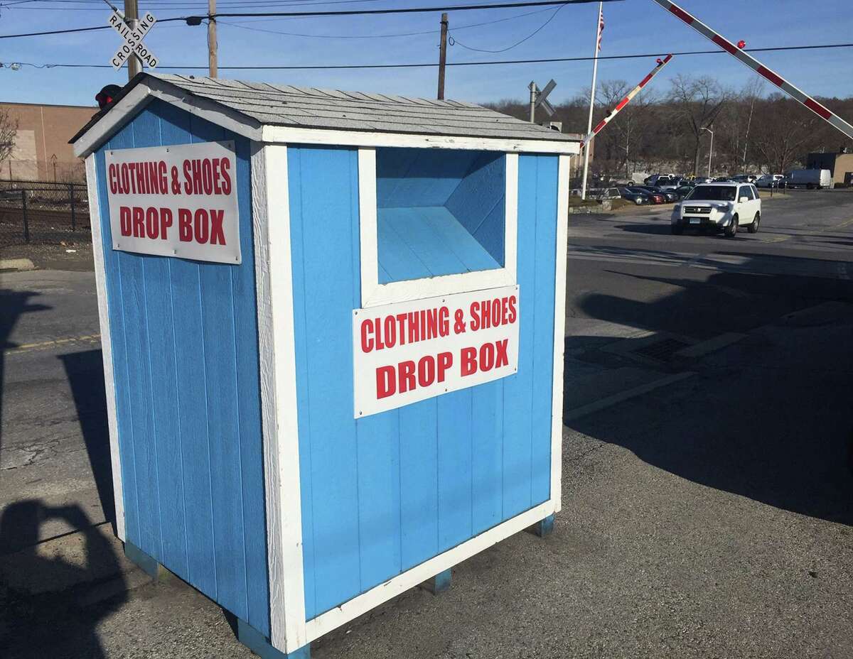 Springdale Diner owner Chris Perisanidis said he has a bin in his parking lot of his restaurant in Stamford, Conn., because a company approached him and offered him money to place it there. The bin, photograph on Tuesday, Feb. 19, 2019, is marked only with a red and white sign that says, “Clothing & Shoes Drop Box.”
