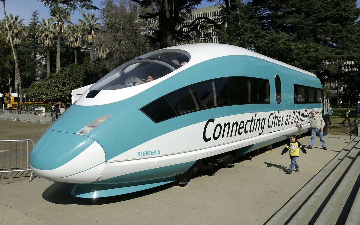 FILE - This Feb. 26, 2015, photo shows a full-scale mock-up of a high-speed train, displayed at the Capitol in Sacramento, Calif. The Trump administration plans to cancel $929 million in U.S. money for California's beleaguered high-speed rail project and wants the state to return an additional $2.5 billion it's already spent. The U.S. Department of Transportation announcement Tuesday, Feb. 19, 2019, came after President Donald Trump last week threatened to make California pay back the money awarded to build the train between Los Angeles and San Francisco. (AP Photo/Rich Pedroncelli, File)