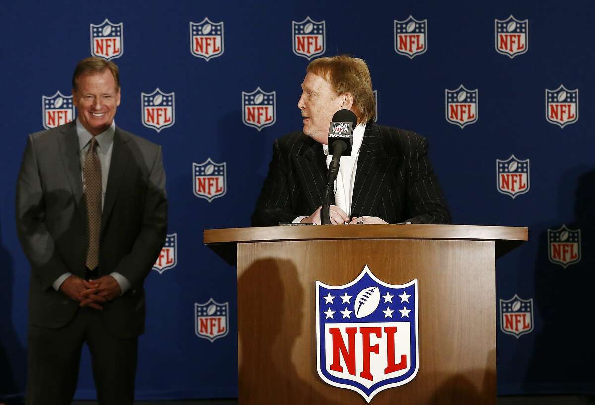 Oakland Raiders owner Mark Davis, right, looks over at NFL Commissioner Roger Goodell, left, during a news conference after owners approved the move of the Raiders to Las Vegas, Monday, March 27, 2017, in Phoenix. (AP Photo/Ross D. Franklin)