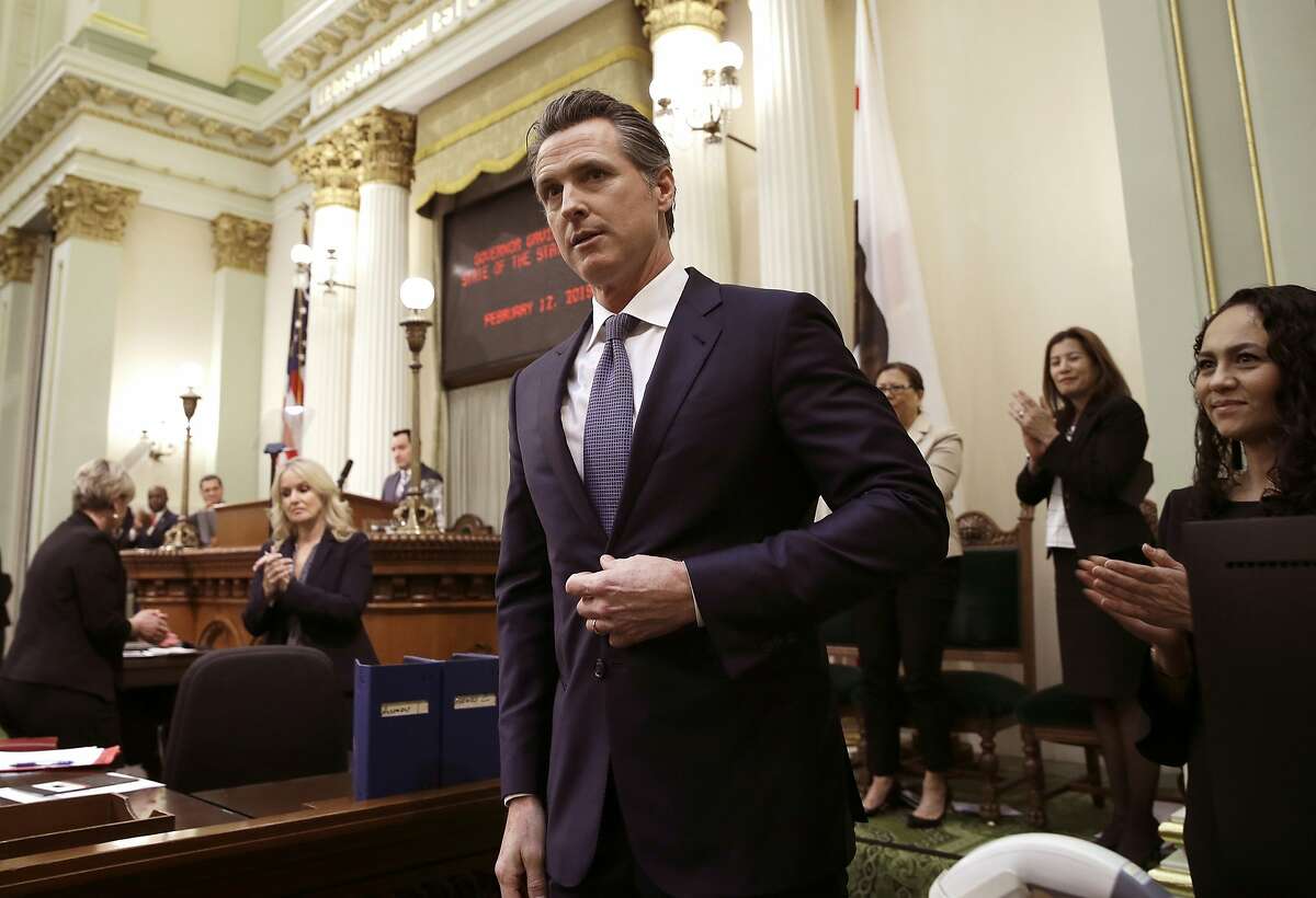 FILE - In this Feb. 12, 2019, file photo, Calif., Gov. Gavin Newsom receives applause after delivering his first State of the State address to a joint session of the legislature at the Capitol in Sacramento, Calif. Newsom declared in his first State of the State address last week that he planned to scale back California's high-speed rail project and focus immediately on building 171 miles of track in central California. The Trump administration said Tuesday, Feb. 19, that it plans to cancel $929 million awarded to California's high-speed rail project and wants the state to return an additional $2.5 billion that it has already spent. (AP Photo/Rich Pedroncelli, File)