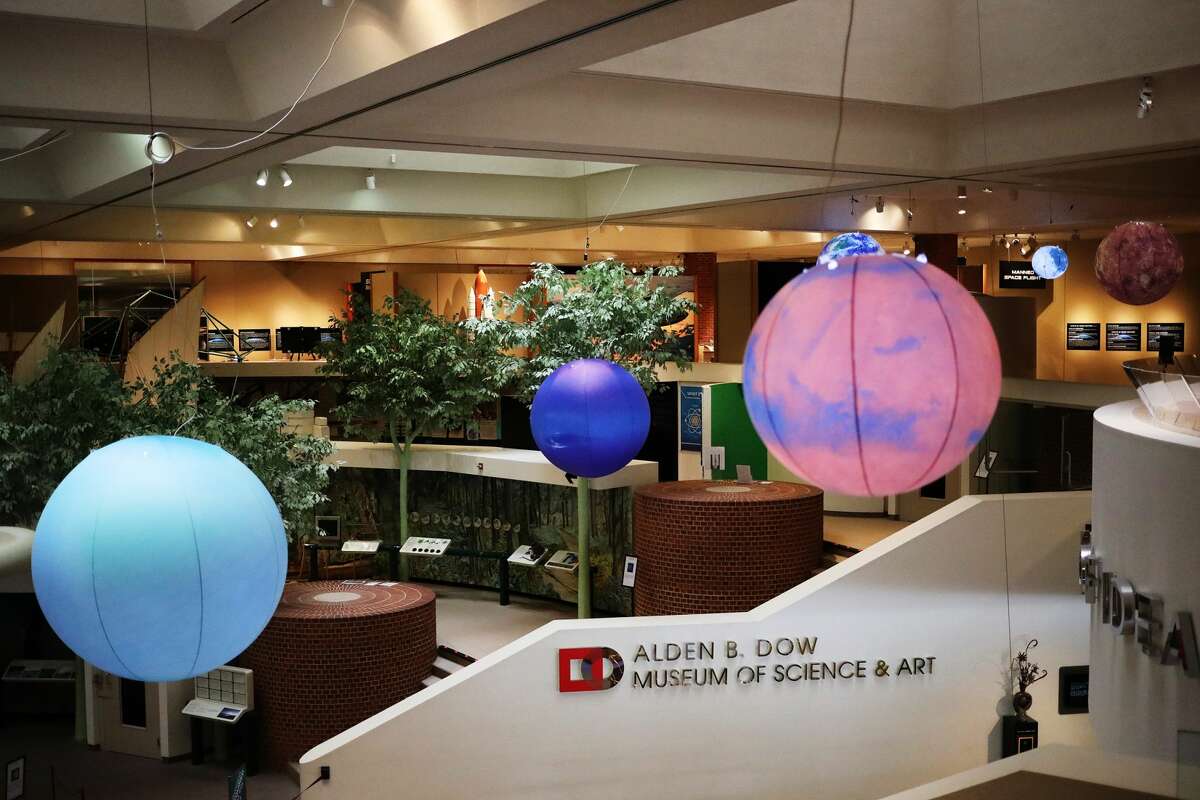 Large inflatable spheres depicting the moon and several planets are part of a new outer space-themed exhibit at the Alden B. Dow Museum of Science & Art. (Katy Kildee/kkildee@mdn.net)