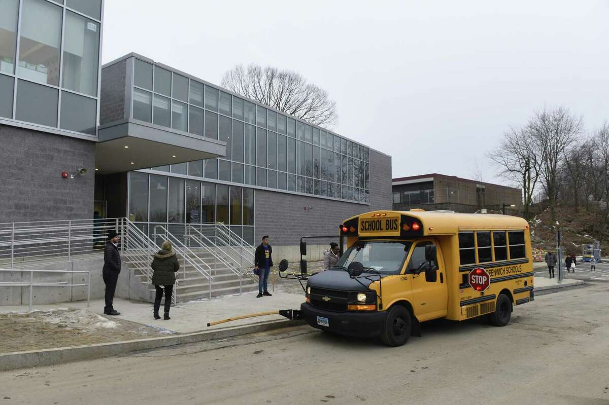 Students enter on the first day of school at the new New Lebanon School in the Byram section of Greenwich, Conn. Wednesday, Feb. 20, 2019.