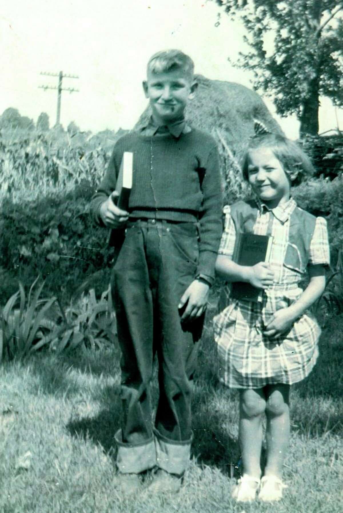 This is Caroline Kern Foster on her first day of school. Her youngest uncle Roland is with her. The photo was taken in 1940. Caroline grew up in a warm and loving family circle in Fairgrove and when her dad Ted decided to move to Beaverton when she was 10, leaving the family behind devastated her.