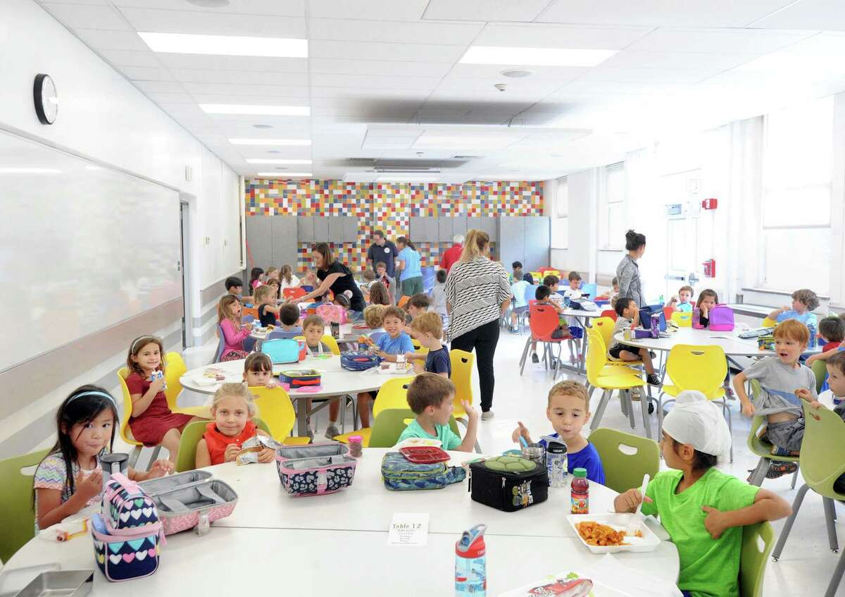 Kindergarten students eat lunch in the renovated cafeteria at the Riverside School in Greenwich, Conn., Friday, Sept. 22, 2017.