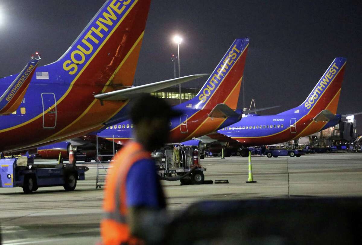 Durrell Hawkins, a load agent with Southwest Airlines, helps load luggage on to a Southwest Airlines Flight to Baltimore at Hobby Airport, Thursday, May 12, 2016, in Houston. ( Jon Shapley / Houston Chronicle )