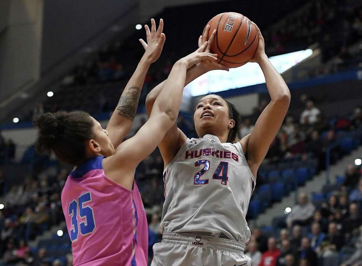 UConn’s Napheesa Collier, right, shoots as Memphis’ Jasmine James defends Wednesday’s game in Hartford.