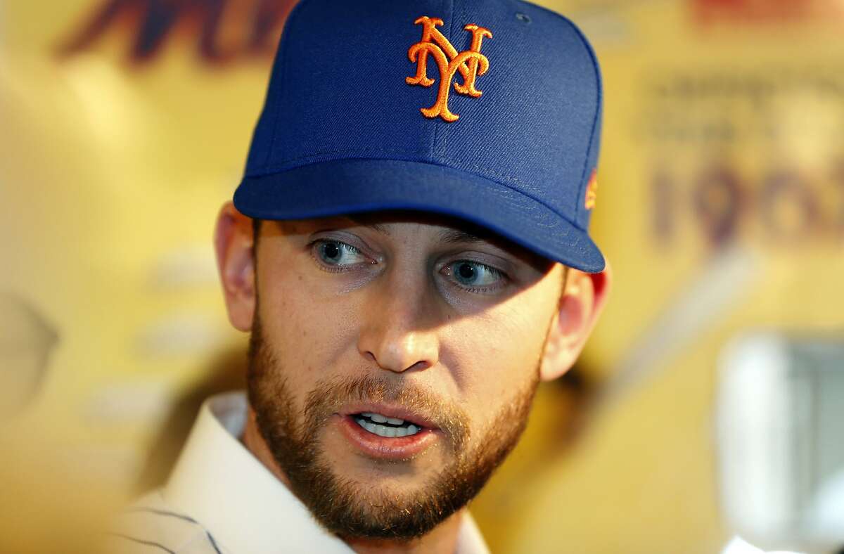 In this Jan. 16, 2019, file photo, New York Mets infielder Jed Lowrie speaks to the media at CitiField following a baseball press conference in New York.