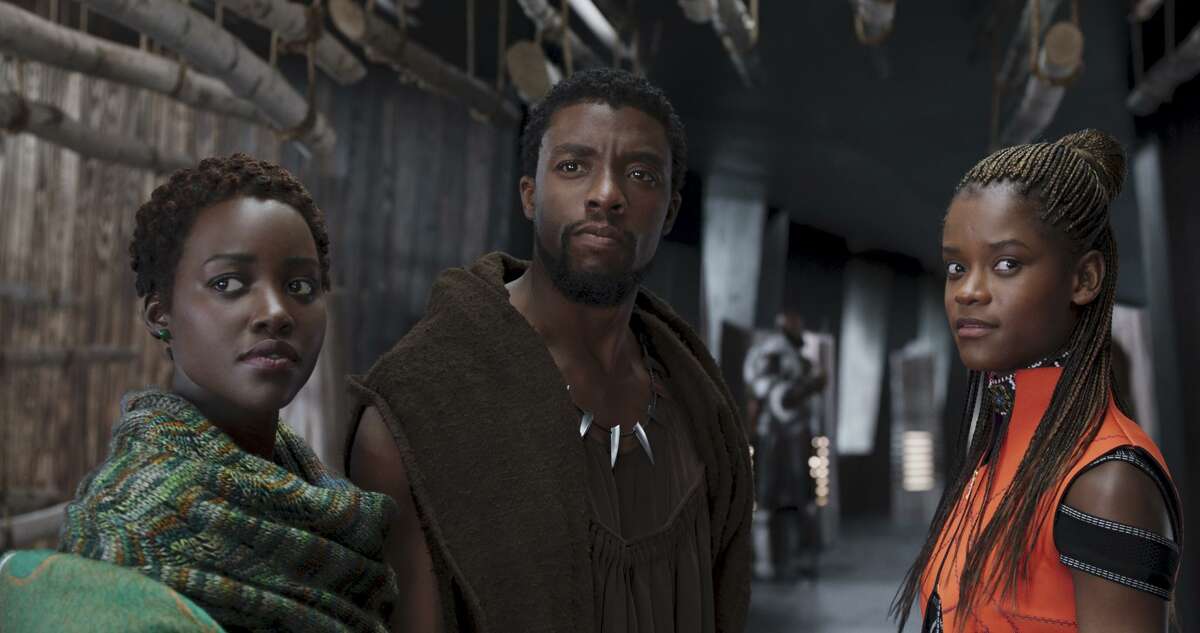 Lupita Nyong'o, from left, Chadwick Boseman and Letitia Wright in a scene from "Black Panther."