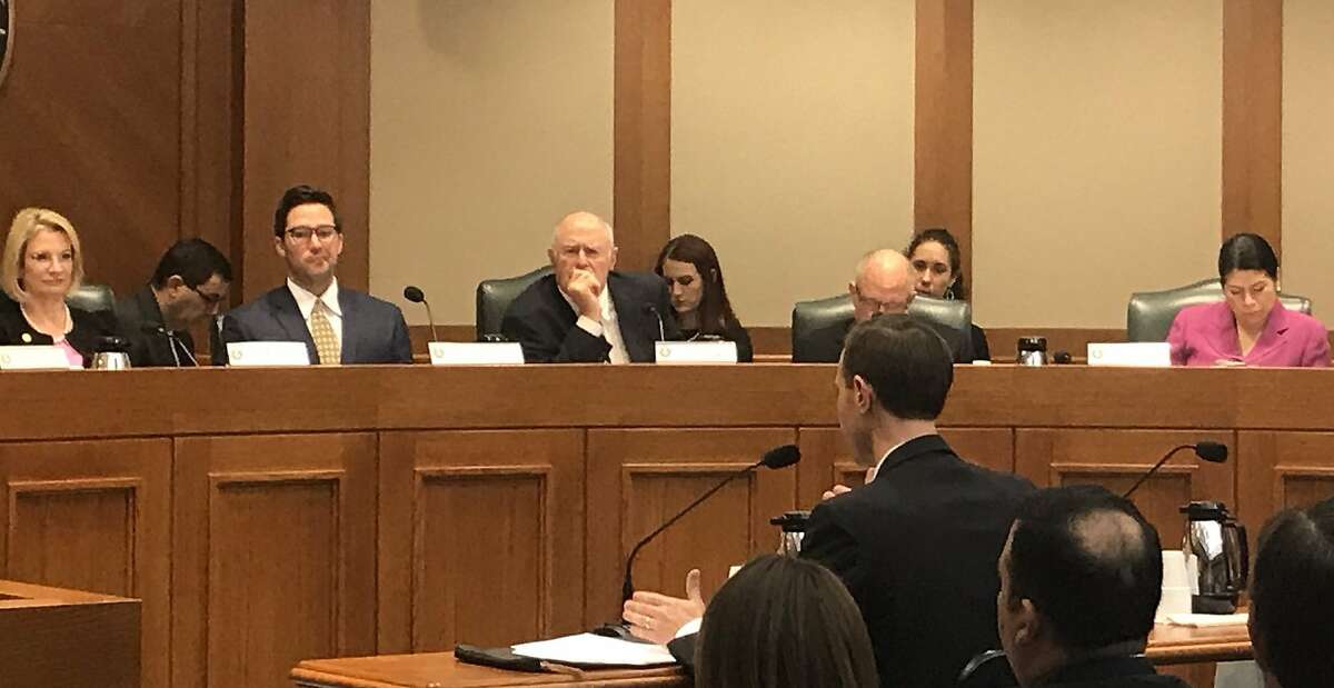 Texas Secretary of State David Whitley, in foreground, testifies before the Senate Nominations Committee about the analysis by his office that fueled an effort to purge tens of thousands of suspected non-citizens from the Texas voter rolls.