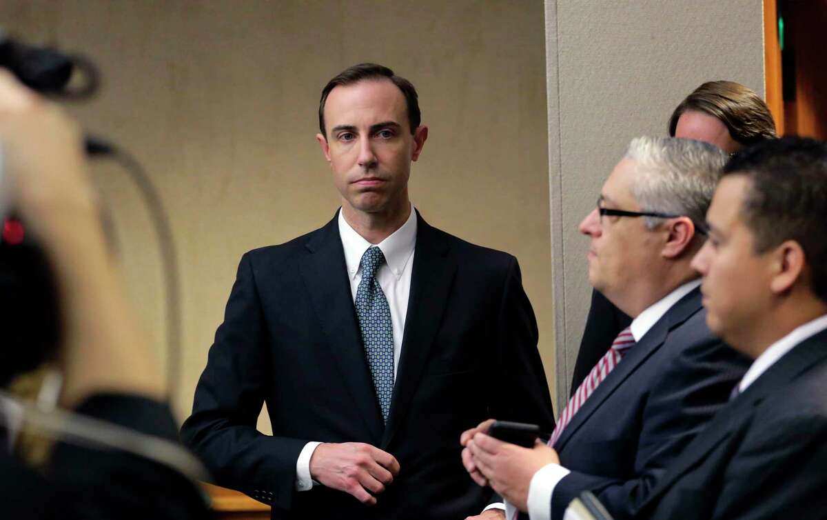 Secretary of State David Whitley, left, arrives for his confirmation hearing, Thursday, Feb. 7, 2019, in Austin, Texas, where he addressed the backlash surrounding Texas' efforts to find noncitizen voters on voter rolls. (AP Photo/Eric Gay)