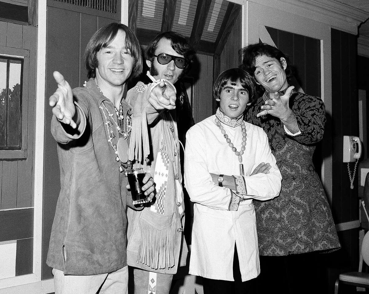 FILE - This July 6, 1967 file photo shows, from left, Peter Tork, Mike Nesmith, David Jones and Micky Dolenz of the musical group The Monkees at a news conference at the Warwick Hotel in New York. Tork, who rocketed to teen idol fame in 1965 playing the lovably clueless bass guitarist in the made-for-television rock band The Monkees, died Thursday, Feb. 21, 2019, of complications related to cancer, according to his son Ivan Iannoli. He was 77. (AP Photo/Ray Howard, File)