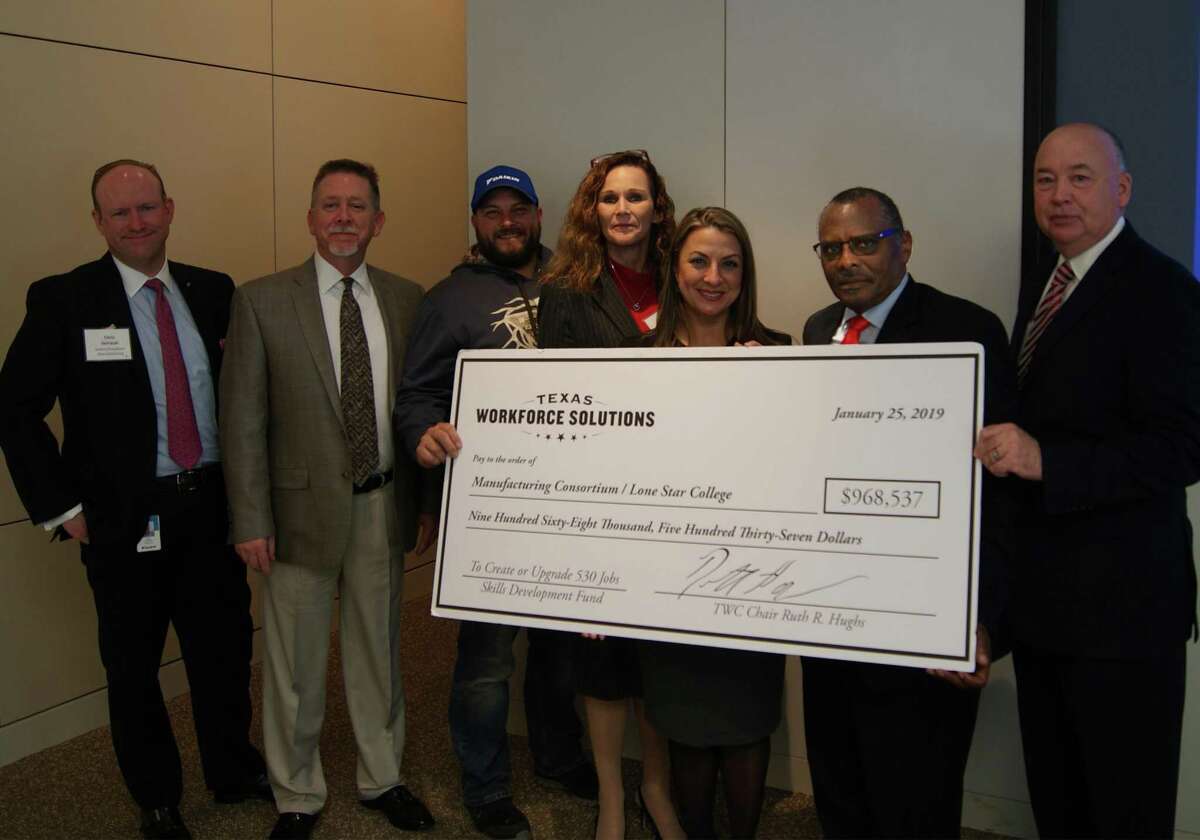 The Texas Workforce Commission awarded Lone Star College with a grant of almost $1 million to help train and hire employees for Daikin Industries. Pictured from left to right are Chris DeVault, Goodman Manufacturing vice president Human Resources; Paul Long, Daikin Industries director Learning Terrance Lindsey, Daikin Industries; Kristi Pittman, Daikin Industries vice president Human Resources; Ruth Hughs, Texas Workforce Commission chair and commissioner; Dr. Alton Smith, Lone Star College chair Board of Trustees; and Dr. Stephen C. Head, Lone Star College chancellor.