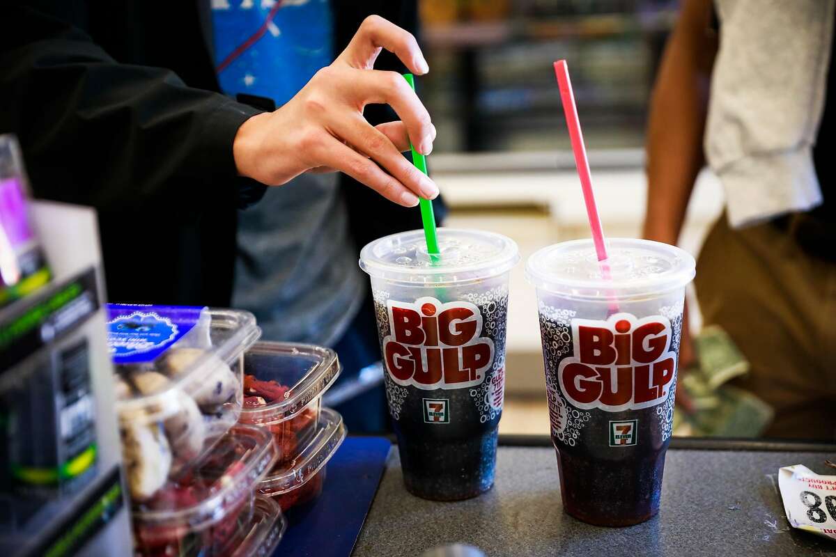 Carlos Ramirez, 16, puts a straw in his Big Gulp soda while purchasing it at 7-11 on Mission Street in San Francisco, California, on Monday, Feb. 18, 2019.