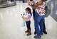 Alida, 5, rests her face on the stuffed animal she brought to George Bush International Airport to receive her mother Sara Caal on Feb. 21, 2019. Caal and Alida who are Guatemalan were separated at the Texas-Mexico border and were not able to see each other for nine months.