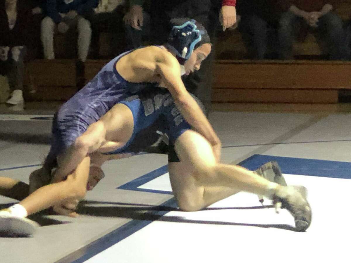 Eli Cyr, top, scored a dominant decision over Bristol Eastern’s Mason Lishness in the team’s recent CCC South meet in Middletown.