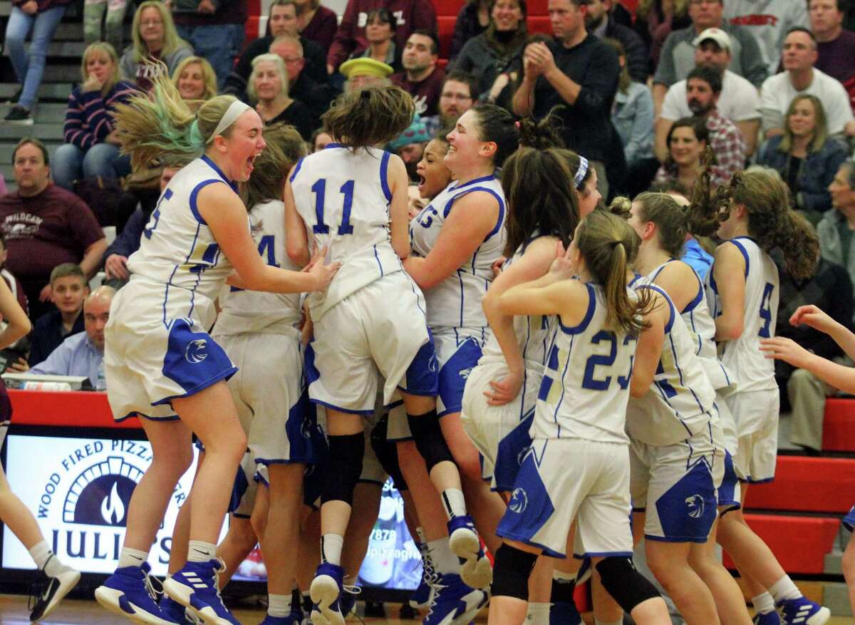 Newtown celebrates its win over Bethel in the SWC championship game Thursday in Southbury.