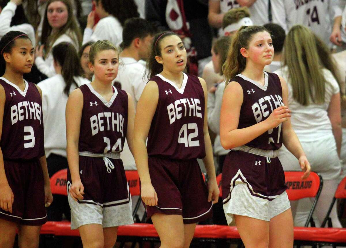 Bethel team members reacts after being defeated by Newtown in SWC girls basketball championship game action in Southbury, Conn., on Thursday Feb. 21, 2019.