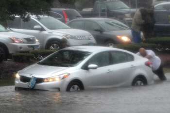 Heavy rains brought difficult travel with standing water and many roads flooded and closed during downpours on Tuesday September 25 2018 in Norwalk Conn.