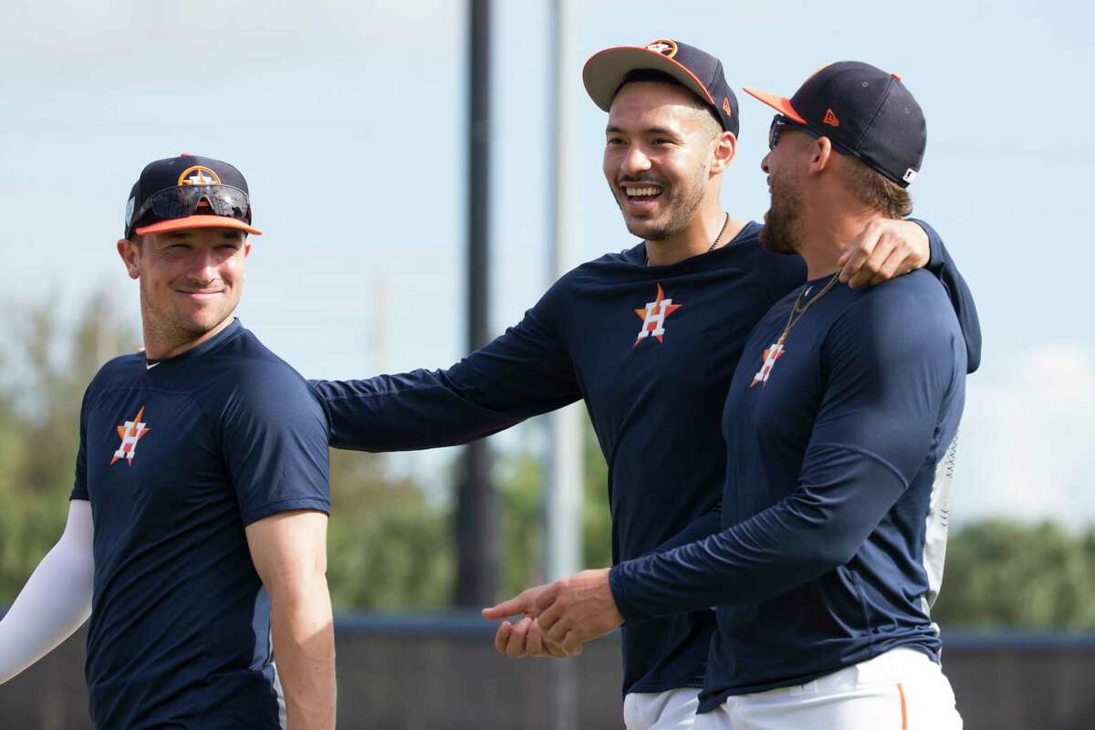 Houston Astros third baseman Alex Bregman, from left, shortstop Carlos Correa and outfielder George Springer between practices at Fitteam Ballpark of The Palm Beaches on Day 9 of spring training on Friday, Feb. 22, 2019, in West Palm Beach.