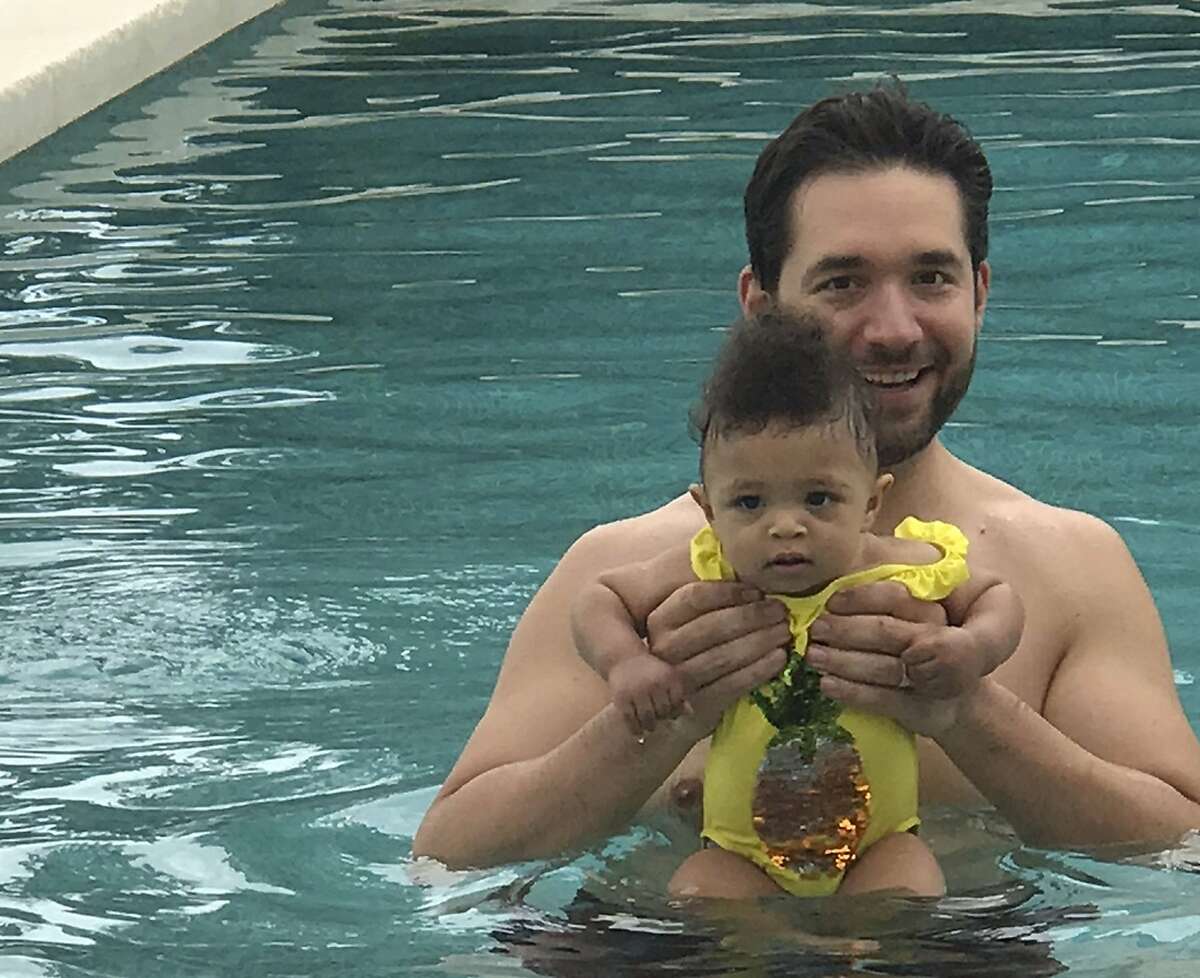 In this undated photo provided by Edelman communications marketing firm, Alexis Ohanian, founder of the social media company Reddit, poses for a photo with his daughter Olympia. Ohanian wants other guys to be jealous of him. Not because he's a multimillionaire venture capitalist. Or because he's married to tennis pro Serena Williams. The Reddit co-founder wants men to covet the time he gets to spend with his 1-year-old daughter, Olympia. (Edelman via AP)