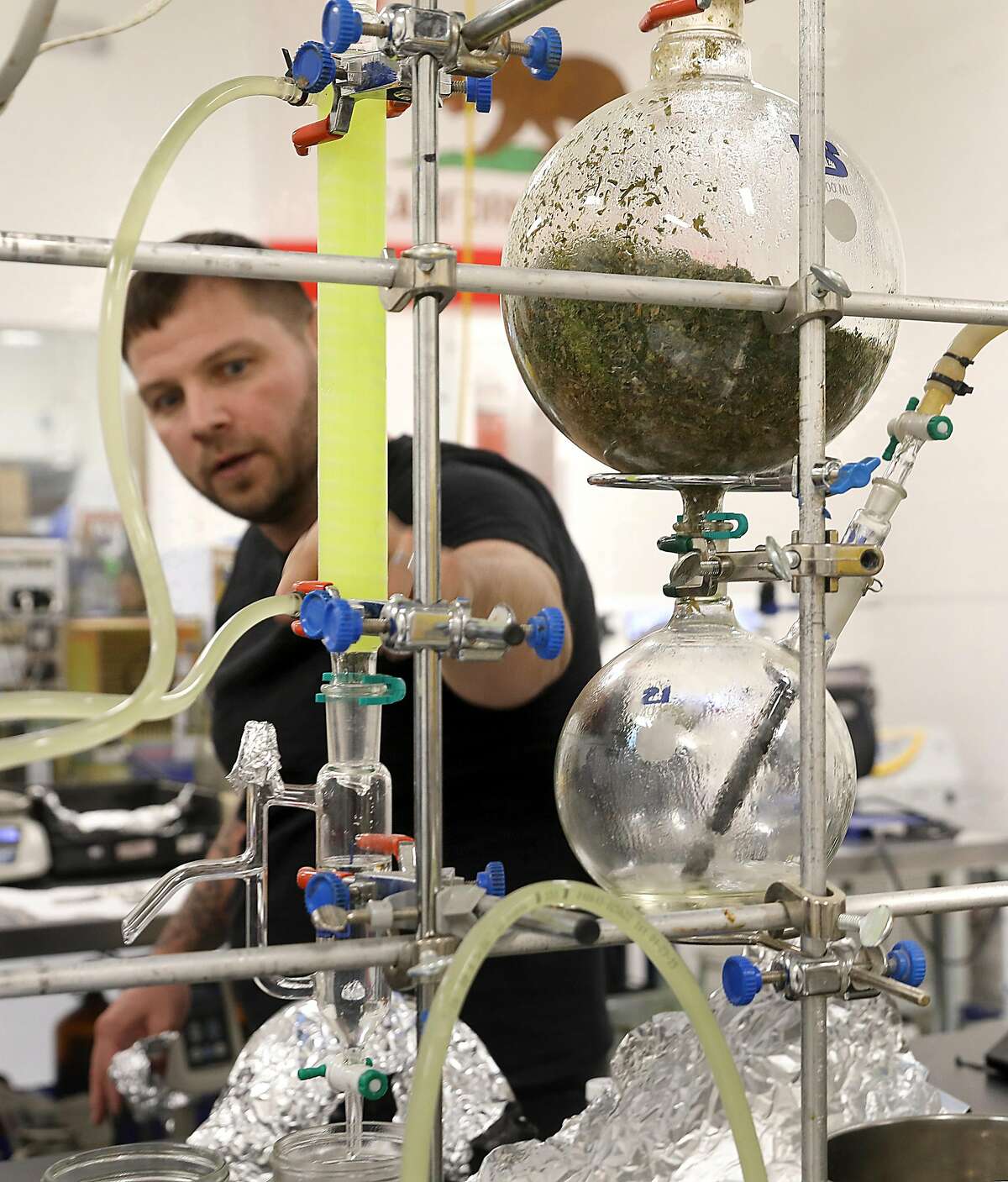 CEO Chris Emerson of Level Blend shows the steam distillation machine (at right) used to make cannabis oil on Tuesday, Feb. 19, 2019, in San Francisco, Calif.