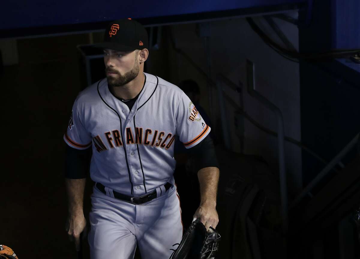 San Francisco Giants' Mac Williamson walks to the dugout before a baseball game against the Miami Marlins, Thursday, June 14, 2018, in Miami. (AP Photo/Lynne Sladky)