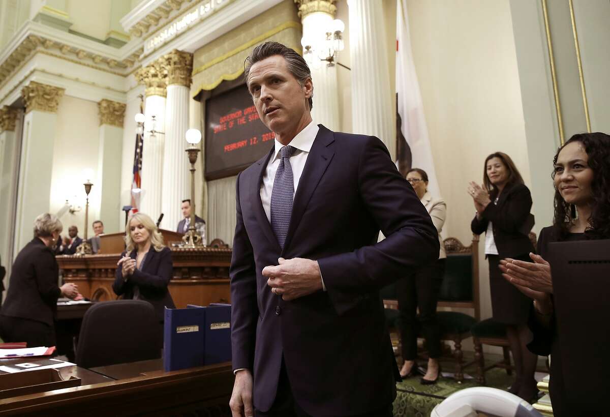 FILE - In this Feb. 12, 2019, file photo, California Gov. Gavin Newsom receives applause after delivering his first state of the state address to a joint session of the legislature at the Capitol in Sacramento, Calif. Newsom is sparring with President Donald Trump over $3.5 billion in federal money the state was awarded to build a high-speed rail line between Los Angeles and San Francisco. (AP Photo/Rich Pedroncelli, File)