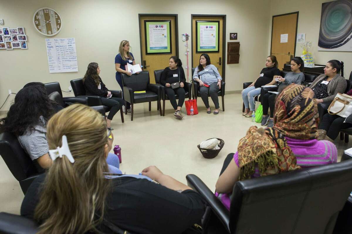 Women gather for a Centering Pregnancy session at El Centro de Corazón in Houston. Marci Mir, CEO of the clinic, says many more women could have been served with family planning cash earmarked for the Heidi Group.