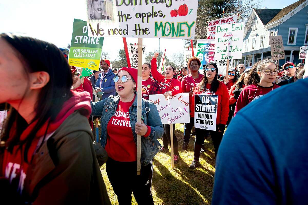 As an Oakland teacher strike enters its second day, teachers and their supporters rally in DeFremery Park on Friday, Feb. 22, 2019, in Oakland, Calif.