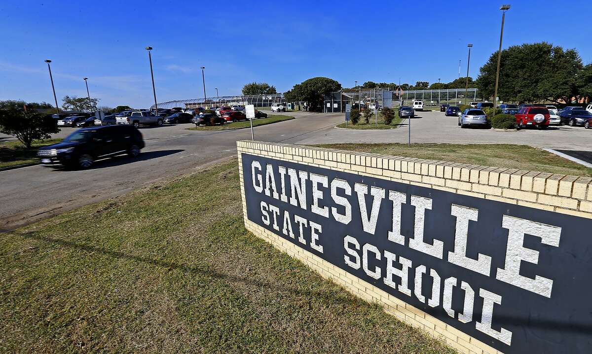 In this Friday, Oct. 28, 2016 photo, an SUV leaves the Gainesville State School in Gainesville, Texas. State officials blame longstanding problems at Gainesville State School in North Texas on the inability to hire and retain qualified staff to supervise hundreds of juvenile delinquents, many of whom suffer from severe mental health and behavioral problems. But juvenile justice advocates say these problems have persisted at the remote, rural lockups under the state’s control for more than a decade. (Jae S. Lee/The Dallas Morning News via AP)