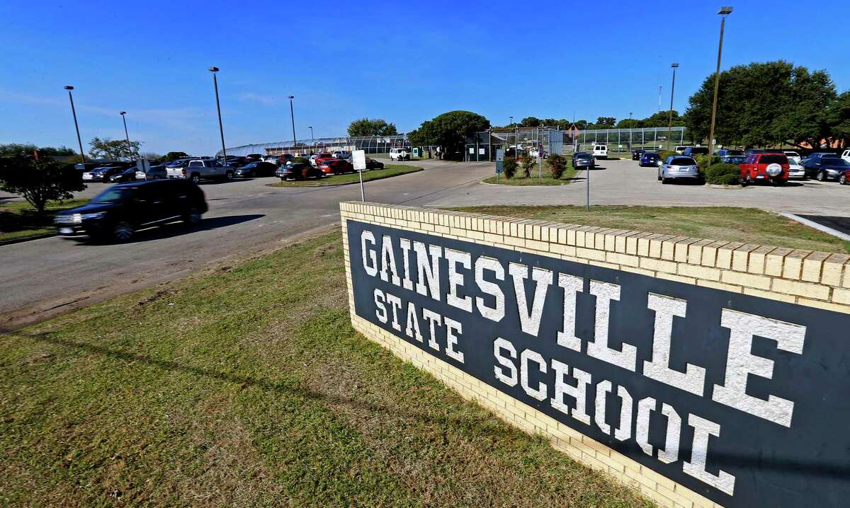 In this Friday, Oct. 28, 2016 photo, an SUV leaves the Gainesville State School in Gainesville, Texas.