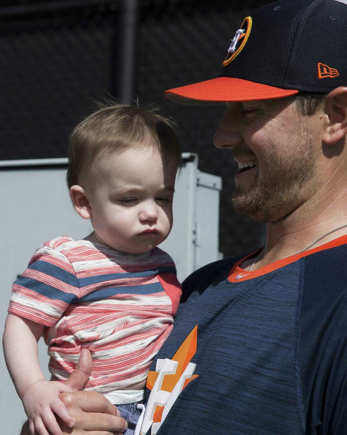 Houston Astros right handed pitcher Brady Rogers' 10-month-old son, Bennett, visits him at Fitteam Ballpark of The Palm Beaches on Day 8 of spring training on Thursday, Feb. 21, 2019, in West Palm Beach.