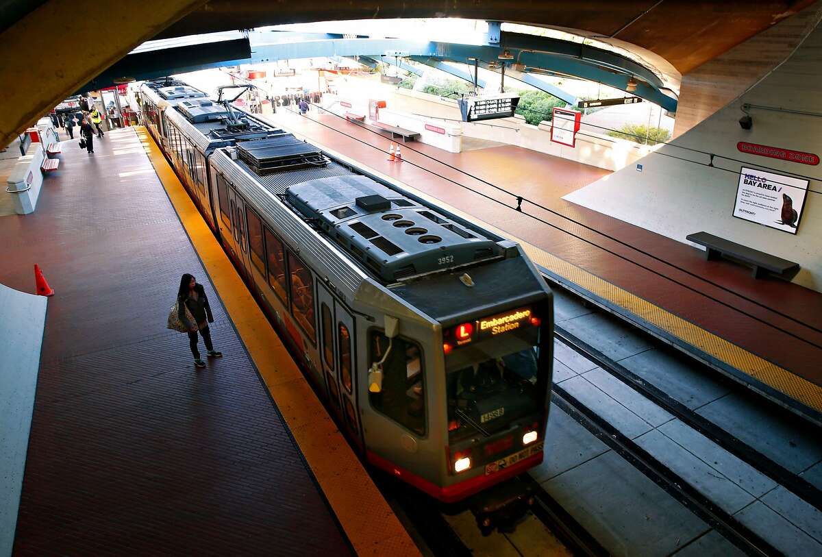 An inbound train pulls into the West Portal Muni station in San Francisco, Calif. on Friday, Feb. 22, 2019. Traffic officers have been assigned to the intersection of West Portal Avenue and Ulloa Street for the past few weeks to control the often congested flow of cars, trucks, buses and streetcars.