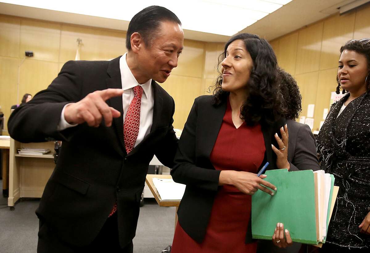 SF public defender Jeff Adachi (left) talks with deputy public defender Anita Nabha (right) who represented robbery suspect Kenneth Humphrey about his release at Hall of Justice on Thursday, May 3, 2018, in San Francisco, Calif. 