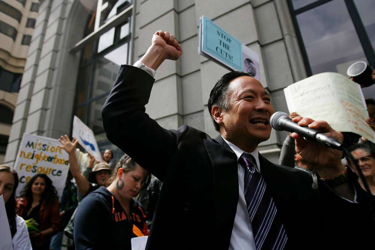 San Francisco Public Defender Jeff Adachi, center, speaks to a group of demonstrators in Hallidie Plaza prior to a march toward City Hall in protest of Mayor Gavin Newsom's budget in Downtown San Francisco on Wednesday, June 10, 2009.