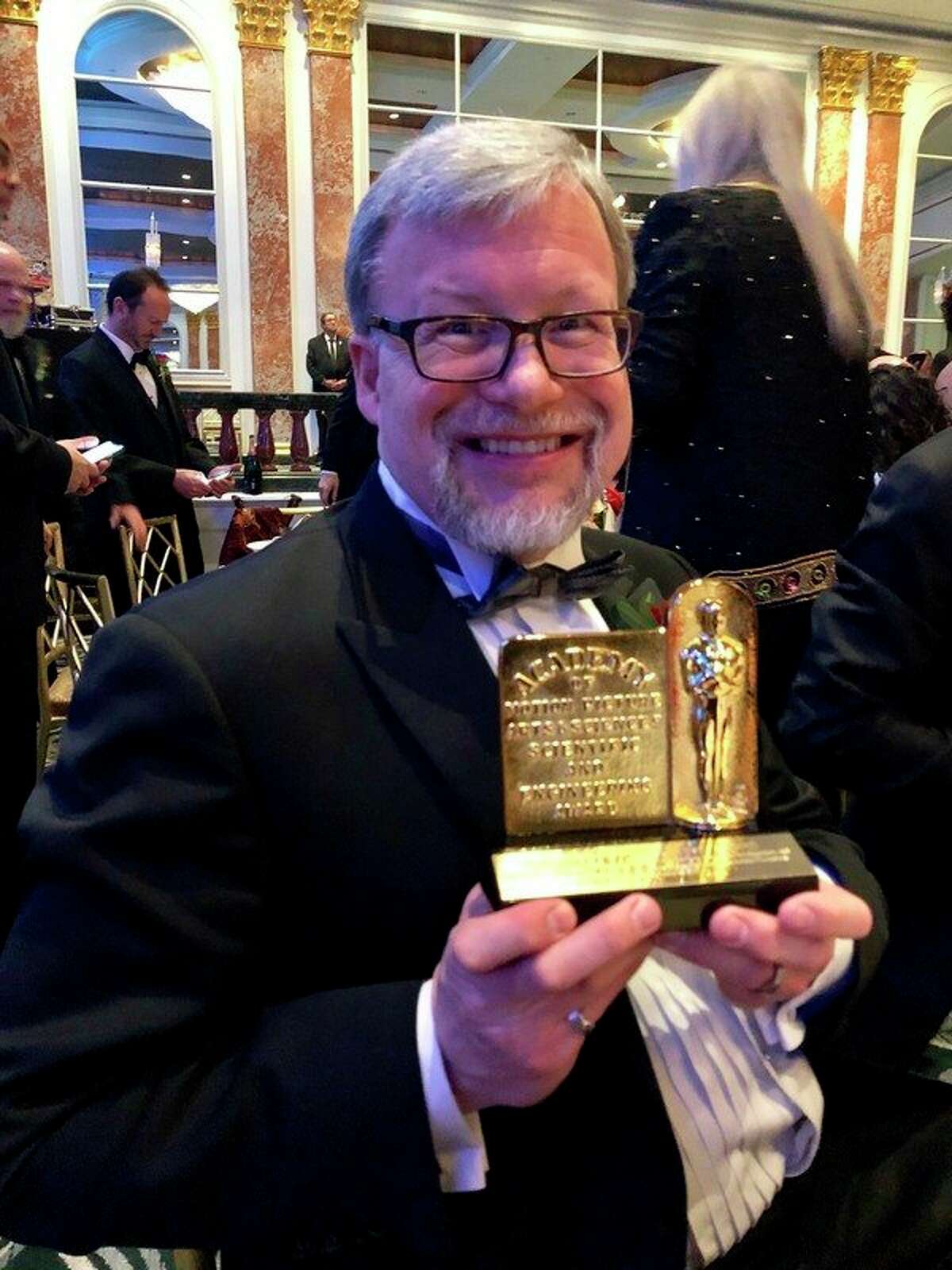 Mark Hamburg holds up his Scientific and Engineering Award from the Academy of Motion Picture Arts and Sciences on Feb. 9 in Beverly Hills, California. (Photo provided)