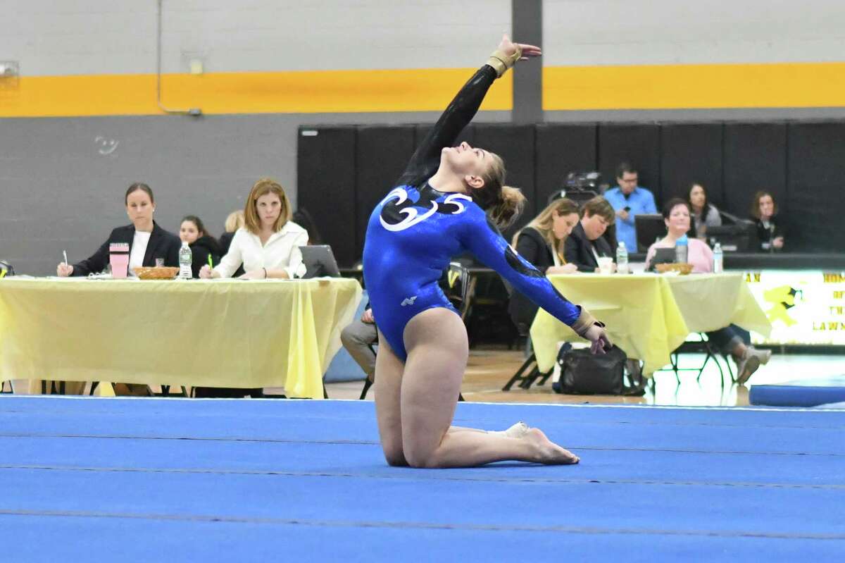 Nicole Carlo of the Darien Blue Wave competes in the floor exercise during the CIAC Class M Gymnastics Championships on Saturday February 23, 2019 at Jonathan Law High School in Milford, Connecticut.