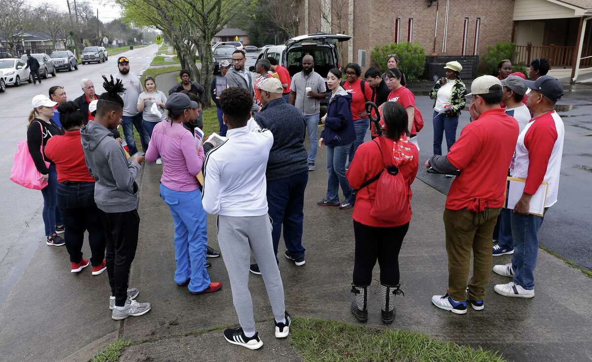 Houston city council member Amanda K. Edwards, center in blue jacket, gives instructions to staff and volunteers before they head out in groups to canvas house affected by the floods of Hurricane Harvey in the Kashmere Gardens neighborhood Saturday, Feb. 23, 2019 in Houston, TX.