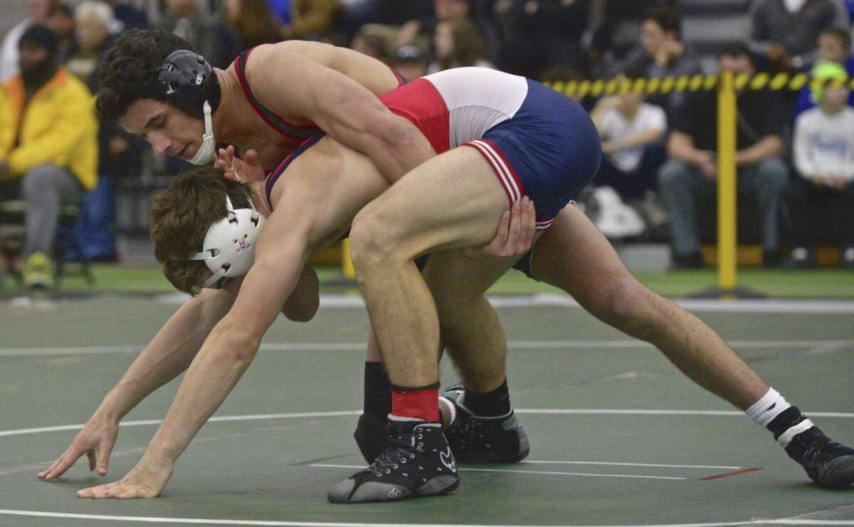 New Canaan's Tyler Sung and Berlin's Daniel Veleas wrestle in the finals for the 145-pound weight class in the Connecticut State Open championships, Saturday, February 23, 2019, at the Floyd Little Athletic Center, New Haven, Conn.