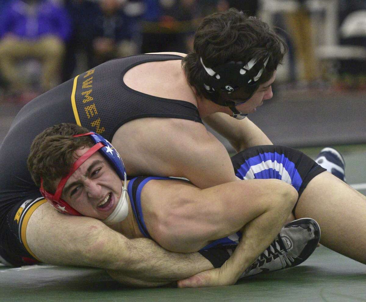 Jonathan Law's Shayne McCourt and Suffeild/Windsor Locks Hunter Adams wrestle in the finals for the 152-pound weight class in the Connecticut State Open championships, Saturday, February 23, 2019, at the Floyd Little Athletic Center, New Haven, Conn.