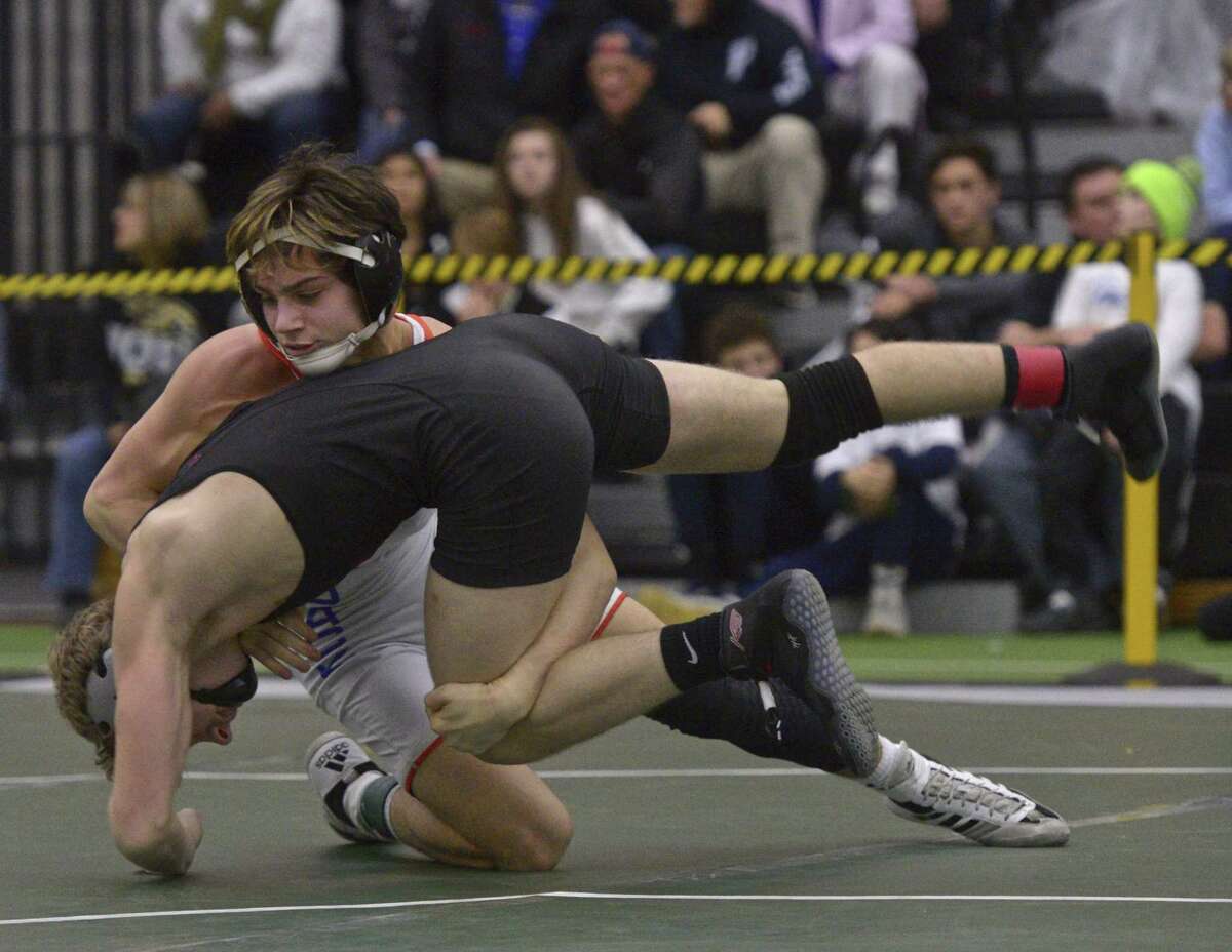 Danbury’s Ryan Jack and Northwestern’s Angelo Folino wrestle in the finals for the 126-pound weight class in the Connecticut State Open championships on Feb. 23 at the Floyd Little Athletic Center in New Haven.