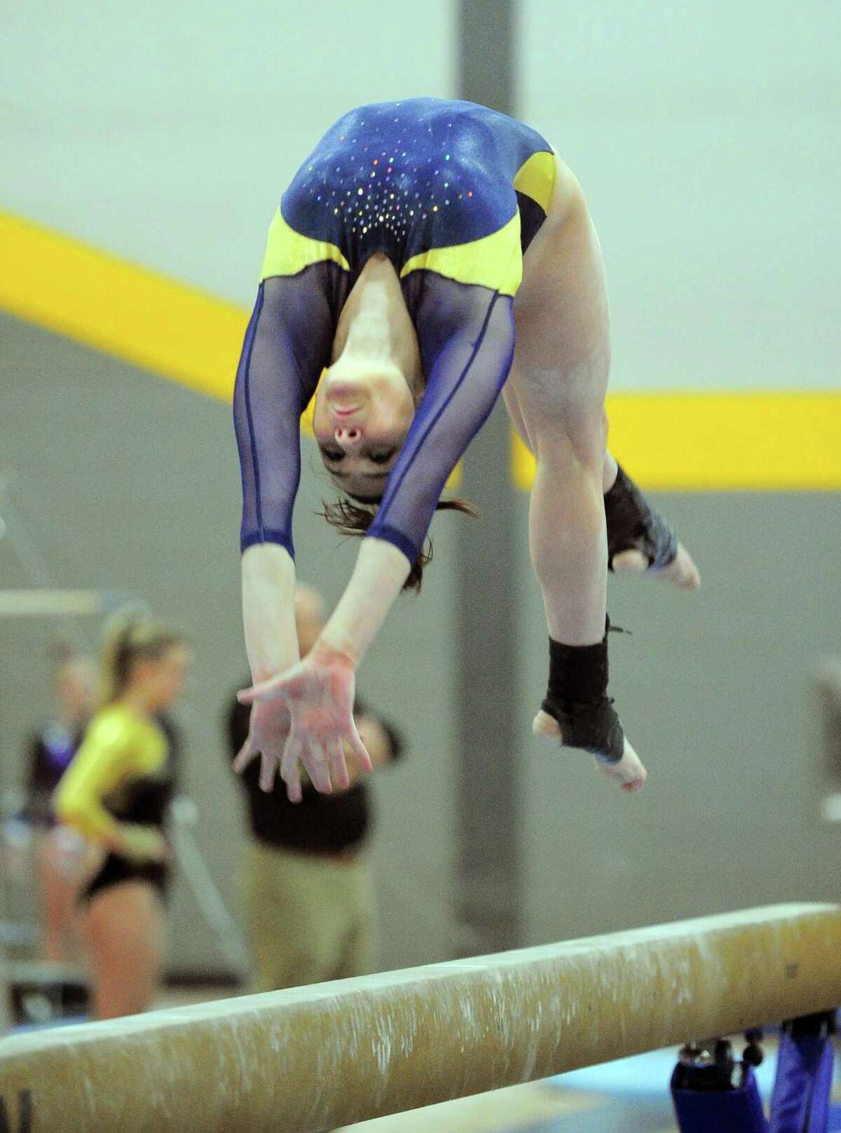 Woodstock Academy's Allison Crescimmano competes on the balance beam during CIAC Class S Gymnastics Championship action in Milford, Conn., on Saturday Feb. 23, 2019.
