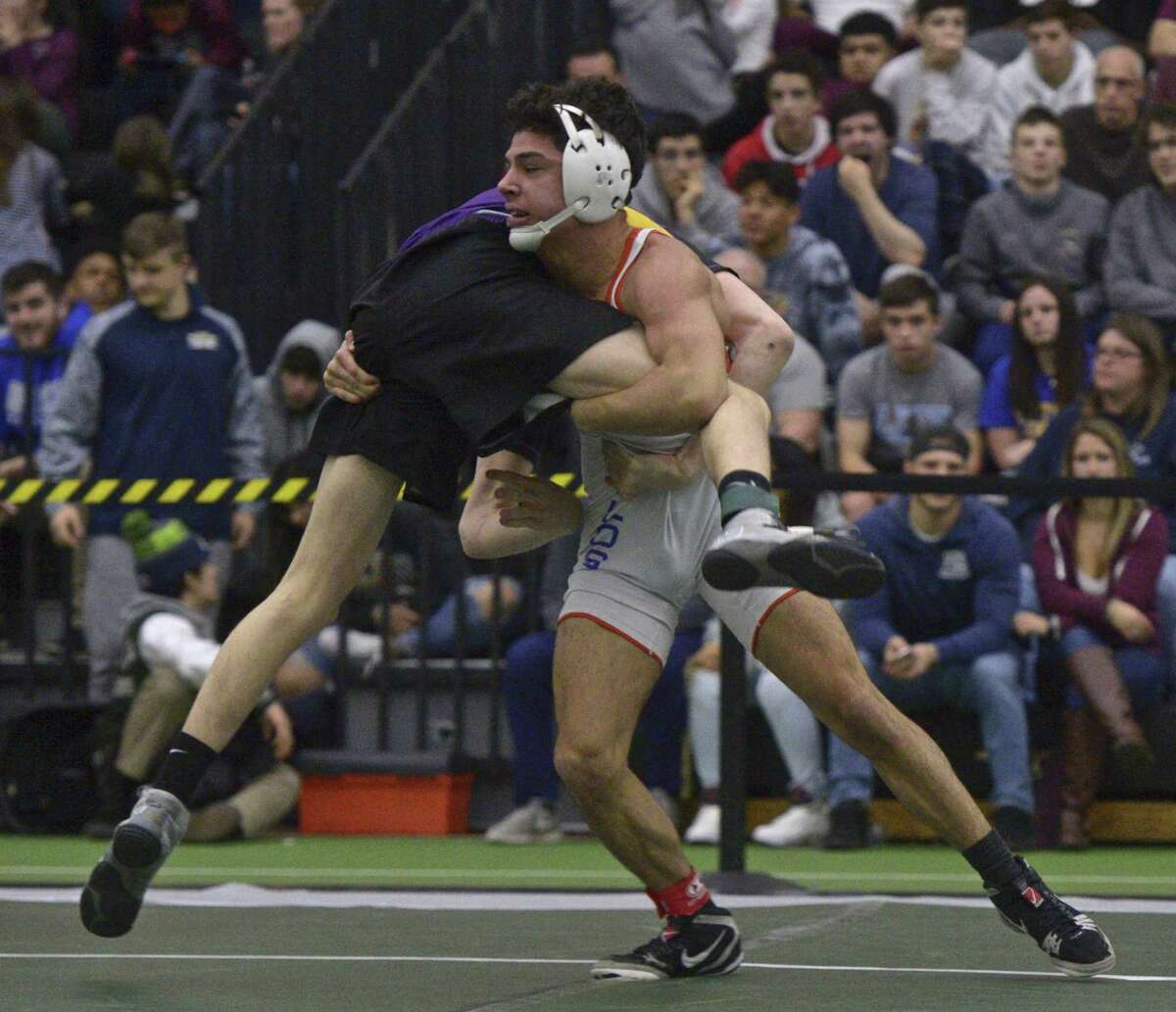 Westhill's Chase Parrot and Danbury's Kyle Fields wrestle in the finals for the 132-pound weight class in the Connecticut State Open championships, Saturday, February 23, 2019, at the Floyd Little Athletic Center, New Haven, Conn.
