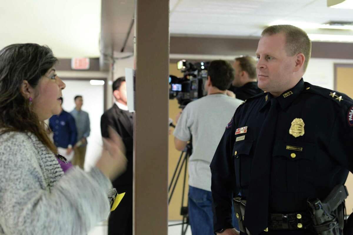 PPD Assistant Chief Josh Bruegger listens to a resident at a public forum meeting on Sunday at St. Peter's.