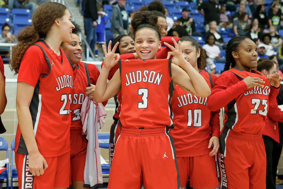 Judson's Corina Carter (center) celebrates at the conclusion of their Region IV-6A girls basketball playoff final with Clark at Northside Gym on Saturday, Feb. 23, 2019. Carter led all scorers with 25 points to help Judson advance to the state tournament with a 71-44 victory over the Lady Cougars.