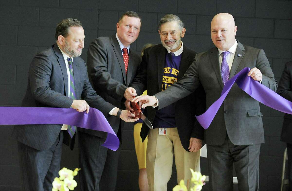 From left, Peter Bernstein, Steve Walko, Superintendent of School Ralph Mayo and Former State Rep. Mike Bocchino officially open the "New" New Lebanon School during community open house and tour of the newly constructed next generation school on Saturday, Feb. 23, 2019 in Greenwich, Connecticut.