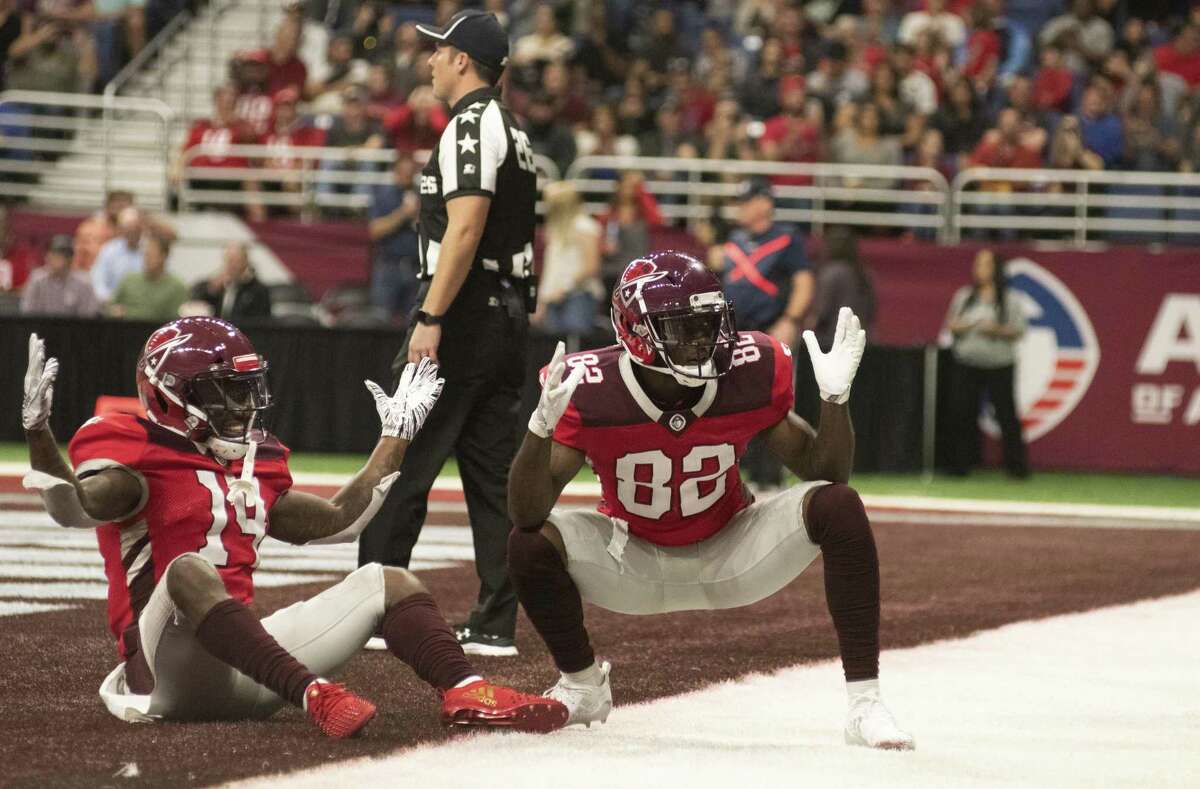San Antonio Commanders De'Marcus Ayers (14) and Makale Mckay (82) prematurely celebrate a touch down first down during the first half of play on Sunday, February 17, 2019.