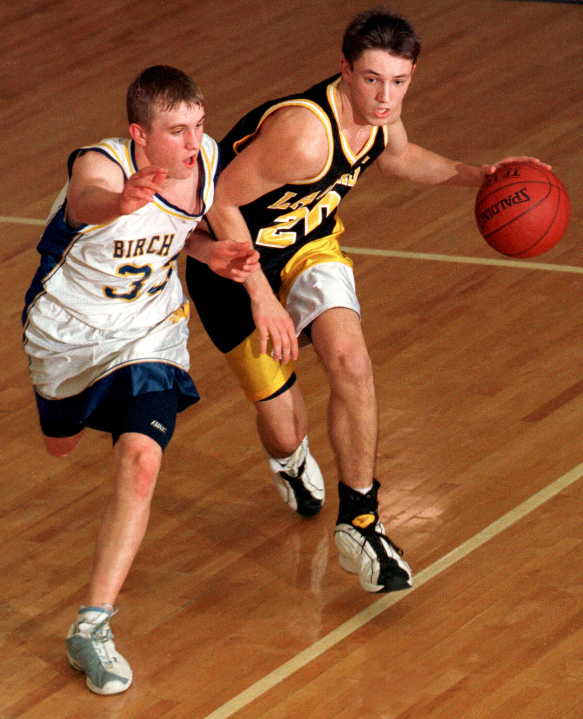 Bullock Creek's Rob Parker breaks the press during a 2001 district final vs. Bay City John Glenn. The Lancers won the district and the regional and went on to edge Beaverton in a thrilling quarterfinal.