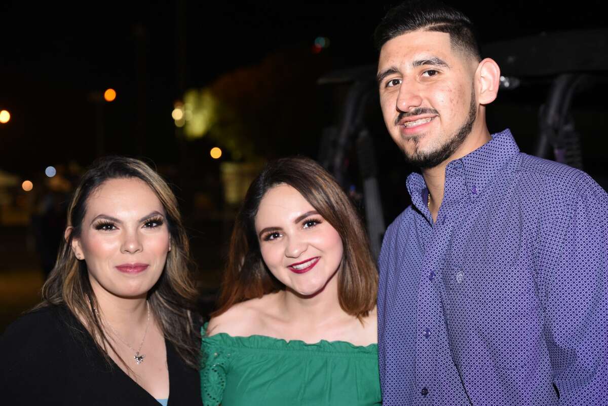 Melva Villarreal, Erika Villa and Roberto Garza pose for a photo during the WBCA Jalapeno Festival.