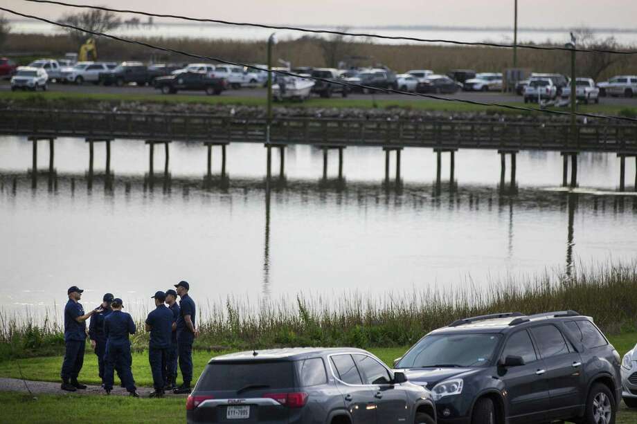 Local and federal officials gathered in a staging area during the crash investigation into Trinity Bay in Anahuac, Texas, on Saturday, February 23, 2019. A transport aircraft to Boeing 's 767 reaction heading to Houston with three people aboard disintegrated after crashing on Saturday' s east bay of the city, according to the sheriff. (Brett Coomer / Houston Chronicle via AP) Photo: Brett Coomer, MBO / Associated Press / © 2019 Houston Chronicle